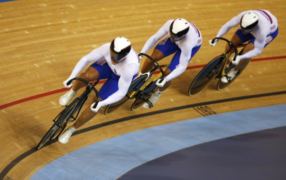 Russia's Sergei Borisov, Denis Dmitriev and Sergey Kocherov compete in the track cycling men's team sprint qualifying heats at the Velodrome during the London 2012 Olympic Games