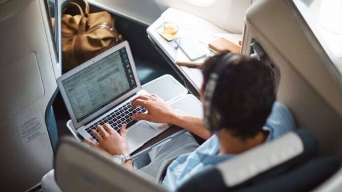 a man working on plane using WI-FI