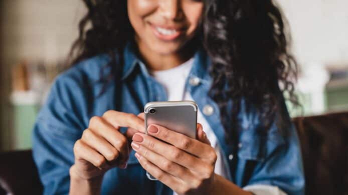 a woman using iPhone